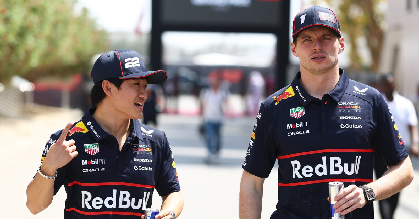 BAHRAIN, BAHRAIN - APRIL 12: Yuki Tsunoda of Japan and Oracle Red Bull Racing and Max Verstappen of the Netherlands and Oracle Red Bull Racing talk in the Paddock prior to final practice ahead of the F1 Grand Prix of Bahrain at Bahrain International Circuit on April 12, 2025 in Bahrain, Bahrain. (Photo by Mark Thompson/Getty Images) // Getty Images / Red Bull Content Pool // SI202504120094 // Usage for editorial use only //