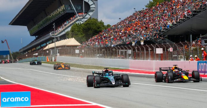 BARCELONA, SPAINISH GP - JUNE 23: George Russell of Mercedes and Great Britain defends against Max Verstappen of Oracle Red Bull Racing and The Netherlands during the F1 Grand Prix of Spain at Circuit de Barcelona-Catalunya on June 23, 2024 in Barcelona, Spain. (Photo by Peter Fox/Getty Images) // Getty Images / Red Bull Content Pool // SI202406230771 // Usage for editorial use only //