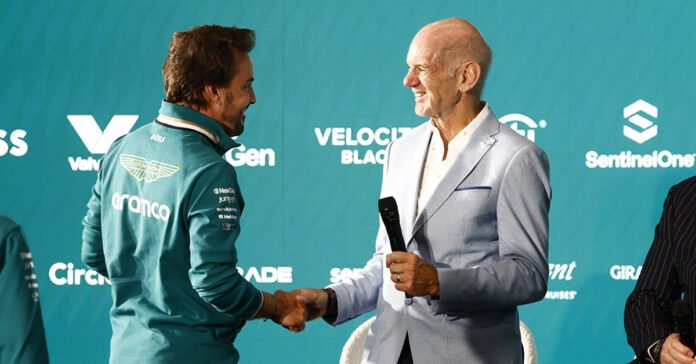 Adrian Newey shaking hands with Fernando Alonso in Silverstone.
