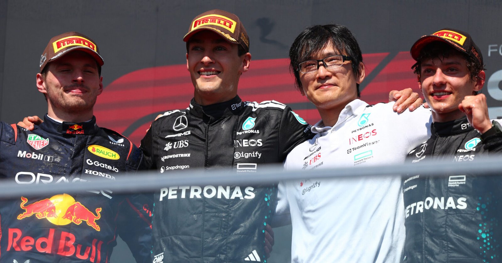 MONTREAL, QUEBEC - JUNE 15: Race winner George Russell of Great Britain and Mercedes AMG Petronas F1 Team Second placed Max Verstappen of the Netherlands and Oracle Red Bull Racing Third placed Andrea Kimi Antonelli of Italy and Mercedes AMG Petronas F1 Team and Katsu Kuwahara, Performance Engineer, Mercedes AMG Petronas F1 Team on the podium during the F1 Grand Prix of Canada at Circuit Gilles-Villeneuve on June 15, 2025 in Montreal, Quebec. (Photo by Andy Hone/LAT Images) // Getty Images / Red Bull Content Pool // SI202506150804 // Usage for editorial use only //