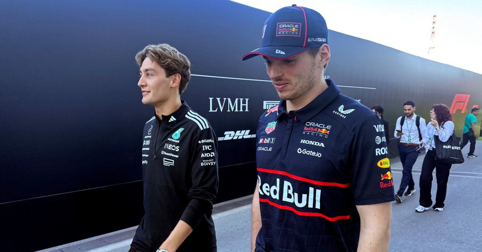 MONTREAL, QUEBEC - JUNE 15: (Editors Note : Image shot on mobile device) Race winner George Russell of Great Britain and Mercedes AMG Petronas F1 Team and Second placed Max Verstappen of the Netherlands and Oracle Red Bull Racing walk back from the Stewards Office during the F1 Grand Prix of Canada at Circuit Gilles-Villeneuve on June 15, 2025 in Montreal, Quebec. (Photo by Clive Rose/Getty Images) // Getty Images / Red Bull Content Pool // SI202506160026 // Usage for editorial use only //