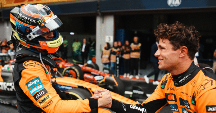 Oscar Piastri and Lando Norris shake hands in Parc Ferme after the Belgian Grand Prix
