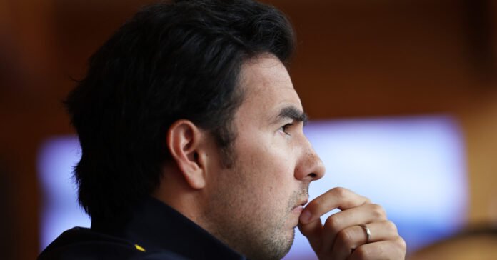 SPIELBERG, AUSTRIA - JULY 07: Sergio Perez of Mexico and Oracle Red Bull Racing looks on in the Paddock during previews ahead of the F1 Grand Prix of Austria at Red Bull Ring on July 07, 2022 in Spielberg, Austria. (SI202207070229 // Usage for editorial use only //