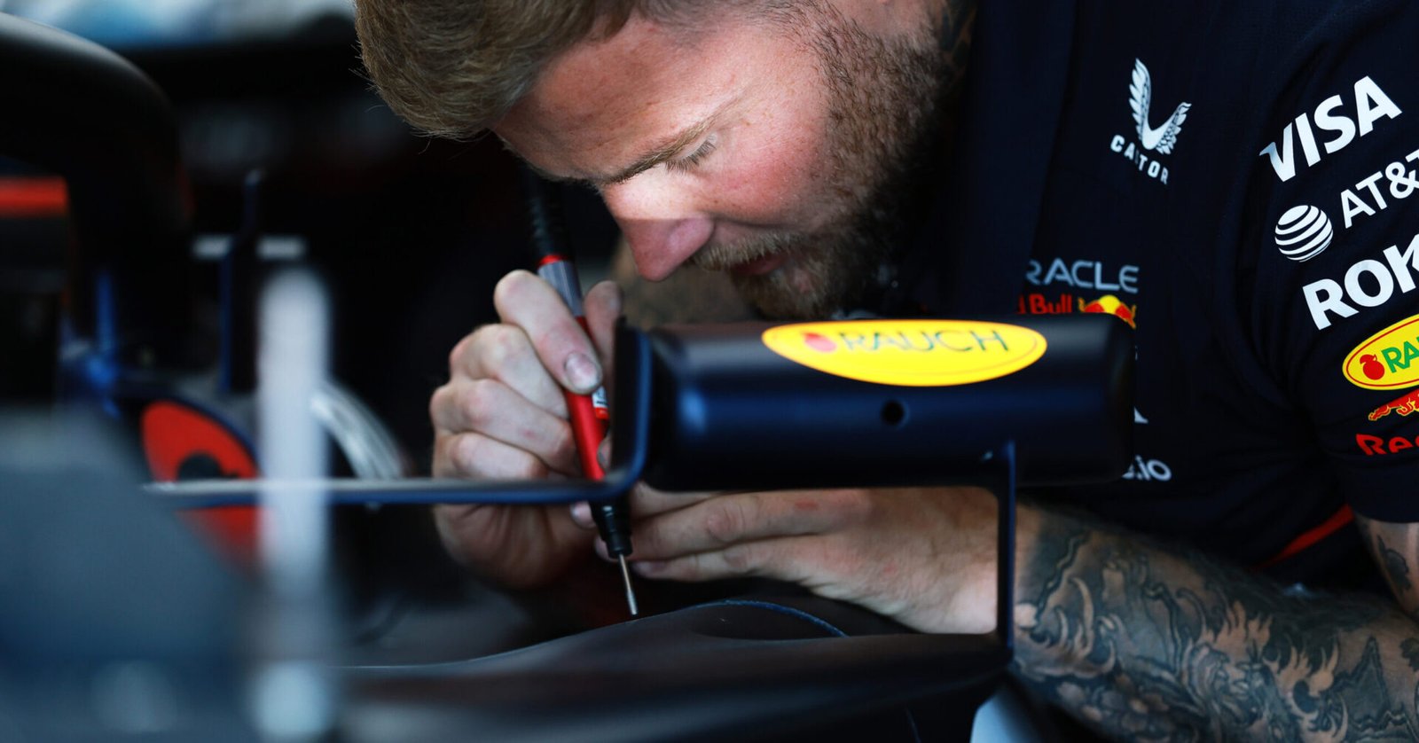 IMOLA, ITALY - MAY 16: A mechanic at work in the Oracle Red Bull Racing garage prior to practice ahead of the F1 Grand Prix of Emilia-Romagna at Autodromo Internazionale Enzo e Dino Ferrari on May 16, 2025 in Imola, Italy. (Photo by Mark Thompson/Getty Images) // Getty Images / Red Bull Content Pool // SI202505160121 // Usage for editorial use only //