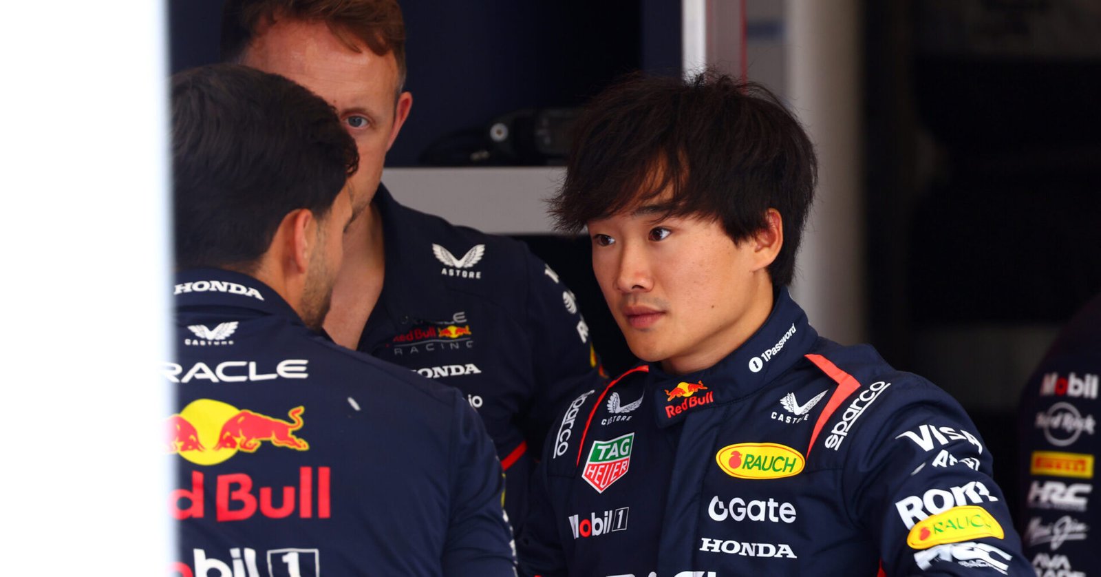 ZANDVOORT, NETHERLANDS - AUGUST 28: Yuki Tsunoda of Japan and Oracle Red Bull Racing talks with a teammate in the garage during previews ahead of the F1 Grand Prix of Netherlands at Circuit Zandvoort on August 28, 2025 in Zandvoort, Netherlands. (Photo by Joe Portlock/Getty Images) // Getty Images / Red Bull Content Pool // SI202508280871 // Usage for editorial use only //