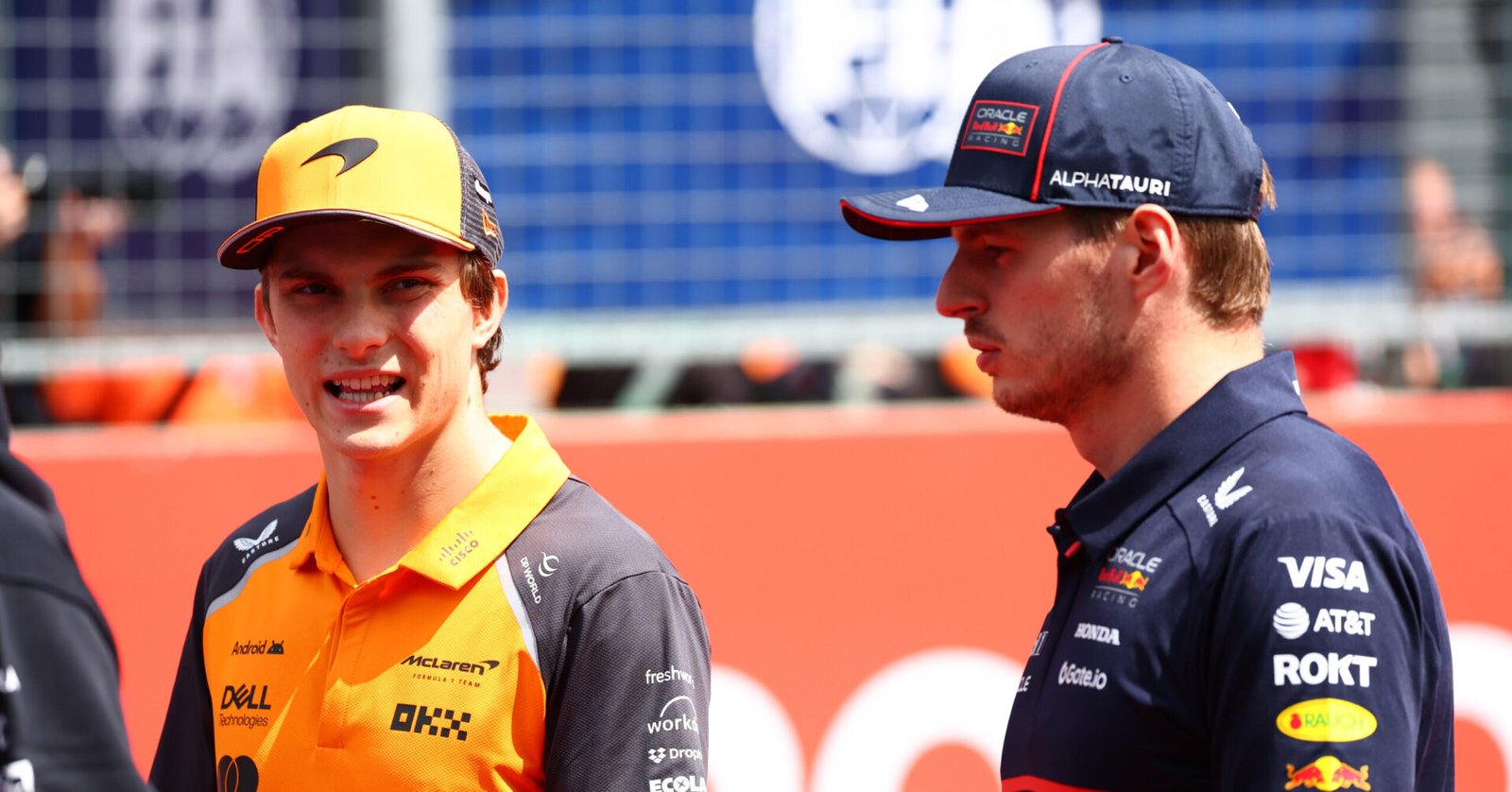 BUDAPEST, HUNGARY - AUGUST 03: Oscar Piastri of Australia and McLaren and Max Verstappen of the Netherlands and Oracle Red Bull Racing talk on the drivers parade prior to the F1 Grand Prix of Hungary at Hungaroring on August 03, 2025 in Budapest, Hungary. (Photo by Joe Portlock/Getty Images) // Getty Images / Red Bull Content Pool // SI202508030311 // Usage for editorial use only //