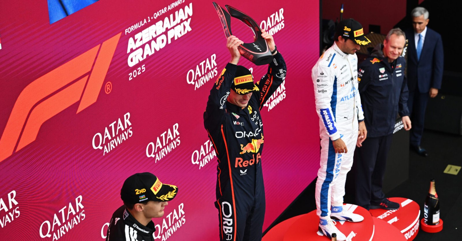 BAKU, AZERBAIJAN - SEPTEMBER 21: Race winner Max Verstappen of the Netherlands and Oracle Red Bull Racing lifts the winners trophy on the podium during the F1 Grand Prix of Azerbaijan at Baku City Circuit on September 21, 2025 in Baku, Azerbaijan. (Photo by Sam Bagnall/Sutton Images) // Getty Images / Red Bull Content Pool // SI202509210500 // Usage for editorial use only //