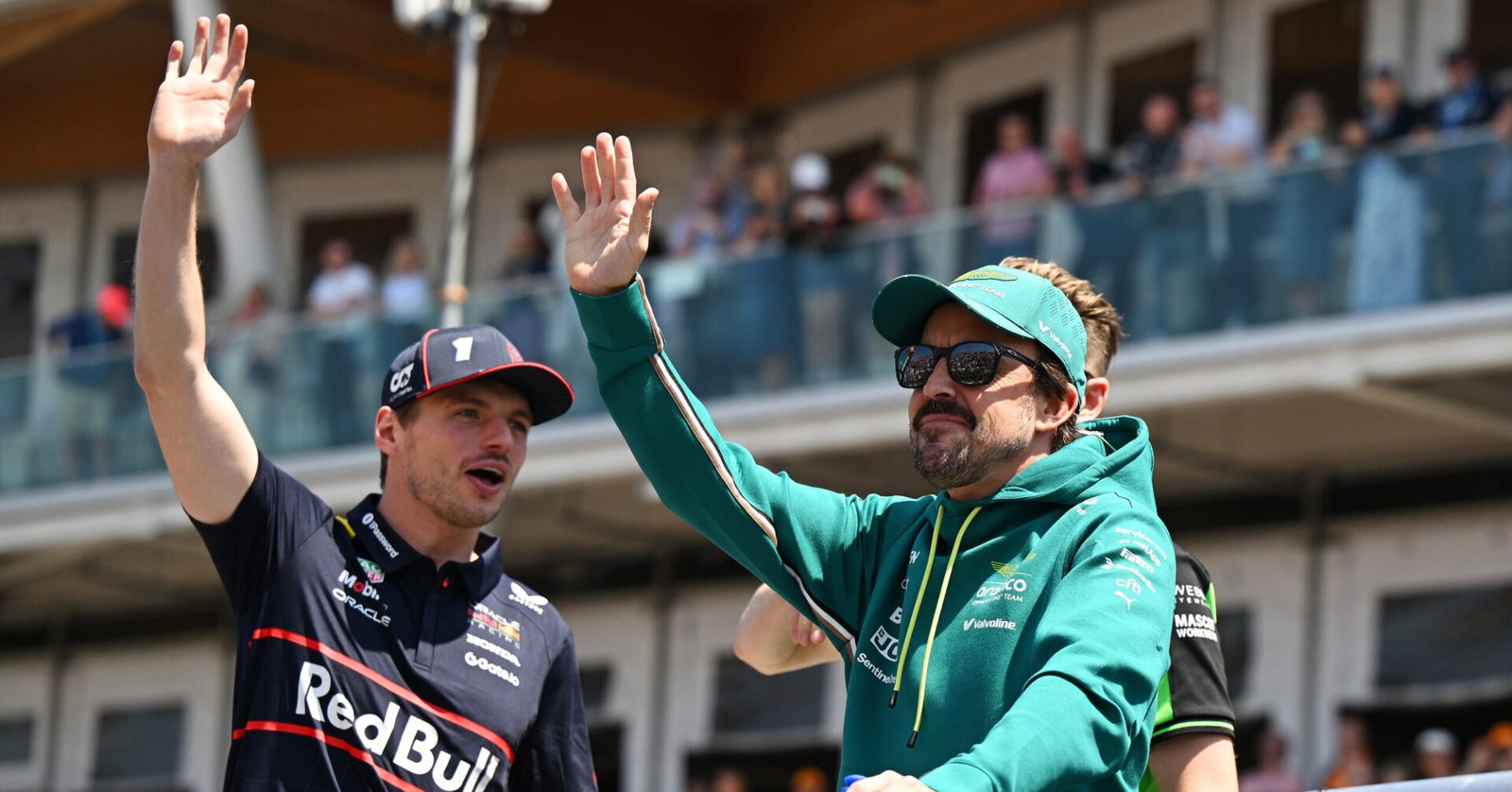 MONTREAL, QUEBEC - JUNE 15: Max Verstappen of the Netherlands and Oracle Red Bull Racing and Fernando Alonso of Spain and Aston Martin F1 Team wave on the drivers parade prior to the F1 Grand Prix of Canada at Circuit Gilles-Villeneuve on June 15, 2025 in Montreal, Quebec. (Photo by Sam Bagnall/Sutton Images) // Getty Images / Red Bull Content Pool // SI202506150400 // Usage for editorial use only //